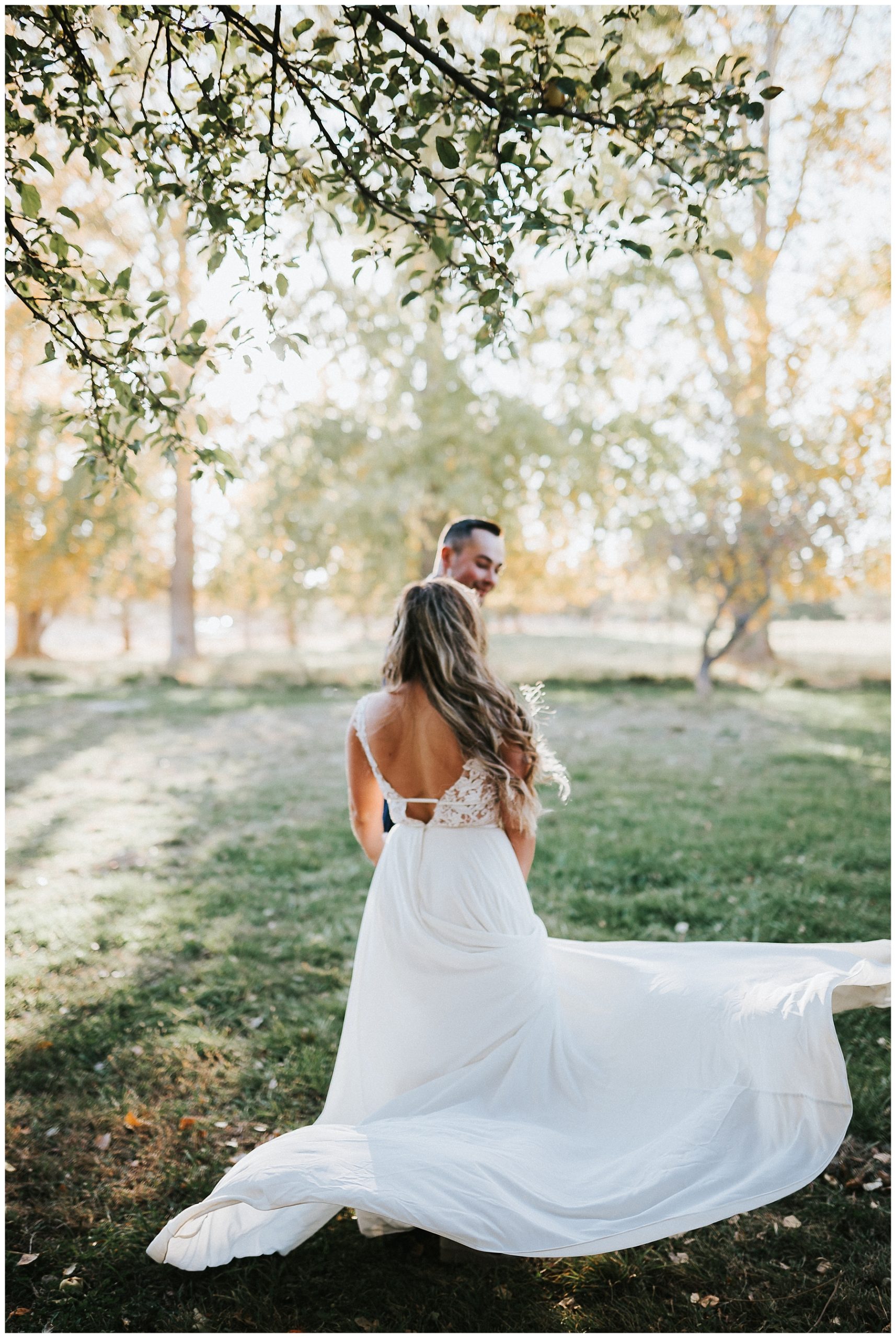 boho-bride-and-groom-dancing-first-dance--long-wedding-dress-with-train-bride-and-groom-flowy-wedding-dress-fall-wedding-twin-falls-idaho-wedding-photographer-finch-film-and-photo